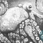 Black and white decoupage paper featuring a detailed painting of an octopus with its tentacles curled around a rock and the octopus