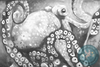 Black and white decoupage paper featuring a detailed painting of an octopus with its tentacles curled around a rock and the octopus