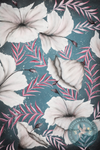 

Elegant floral pattern featuring large white hibiscus flowers with soft shading, pink and purple leaves, and small dark purple buds on a dark blue background.