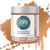 Artisan paint jar with 'Wanderlust Metallics' label on a brown paint splatter background