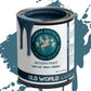 A can of 'Old World' gray blue clay and chalk paint with a label featuring a unicorn. The paint is dripping from the can, indicating its creamy consistency.