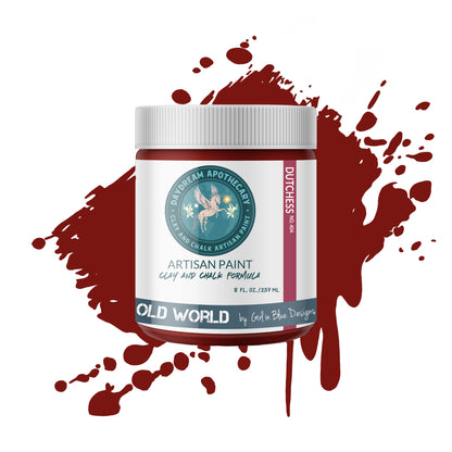 Artisan paint jar with a red paint splatter on a white background